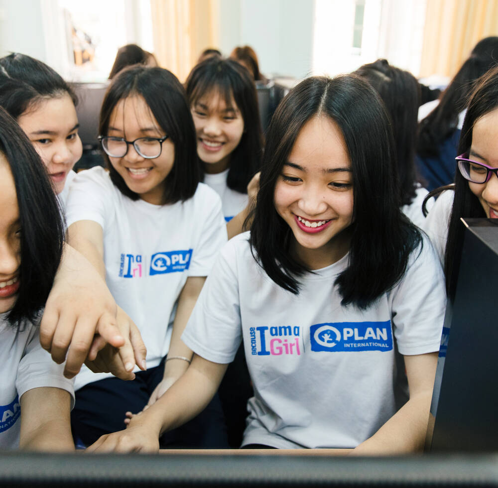Girls in Hanoi participate in Plan International and UN-Habitat's joint workshop where they use Minecraft to redesign their aspects of their neighborhood to better include women.