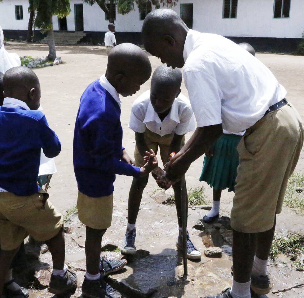 Kitangiri Primary school students at the water point. 