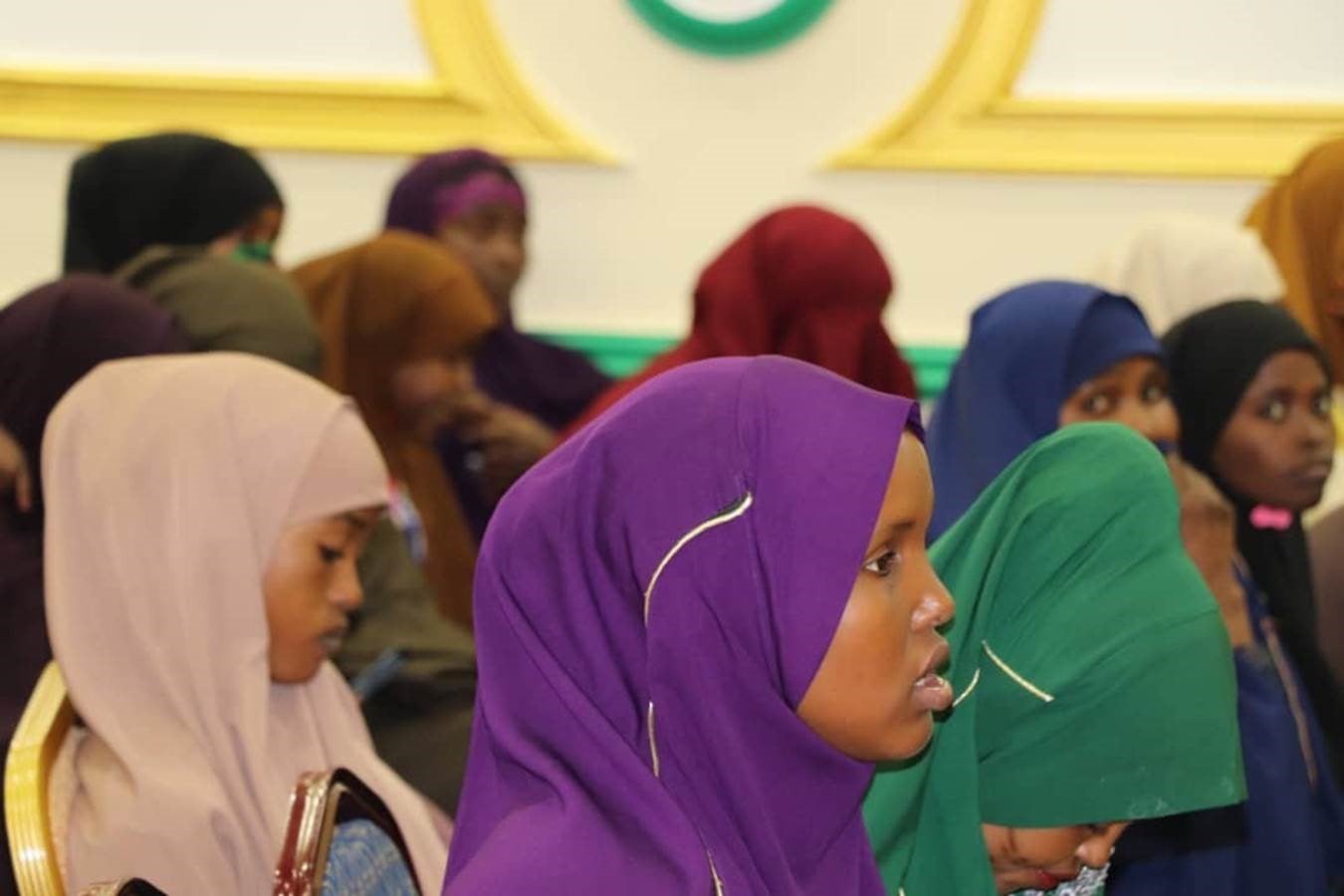 Young women trainees closely following the job fair event and words of encouragement from the local employers