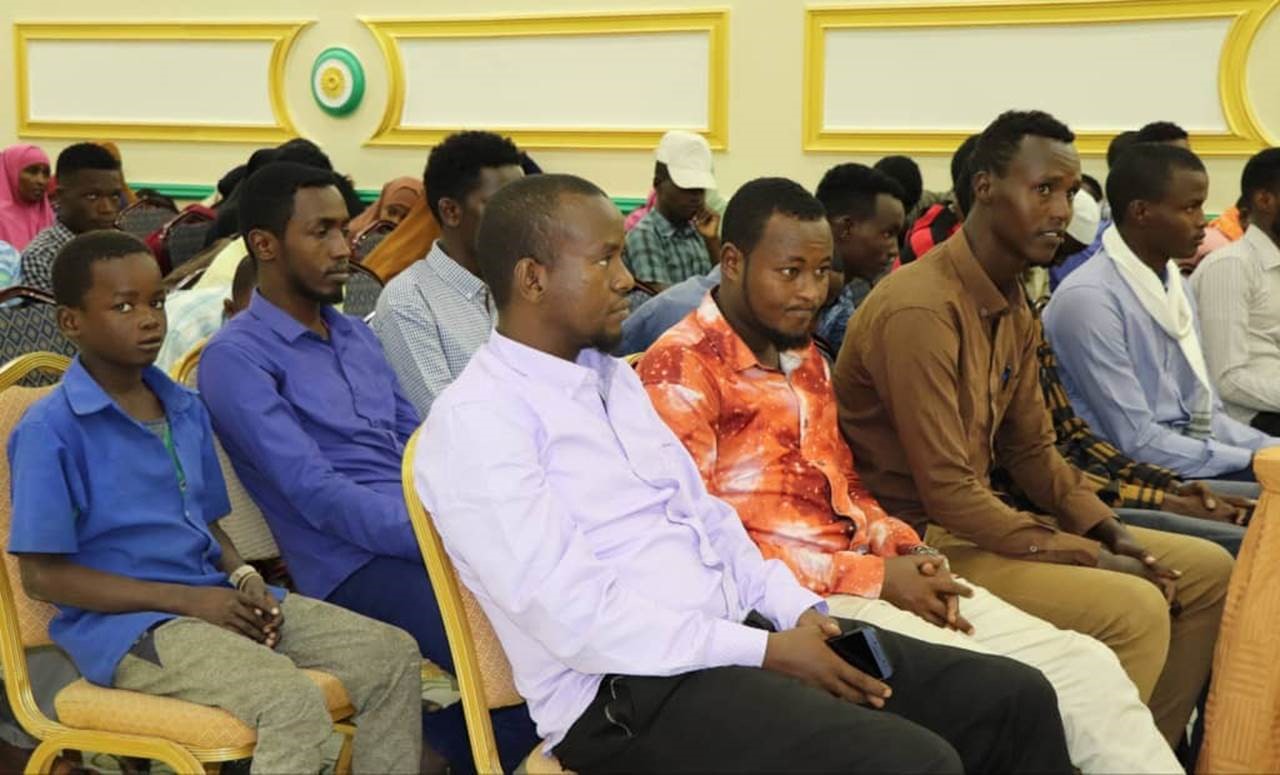 Youth keenly listening to a word of motivation from the Director General of Ministry of Youth and Sports Mr. Abdirahman Abdi during Kismayo Job fair