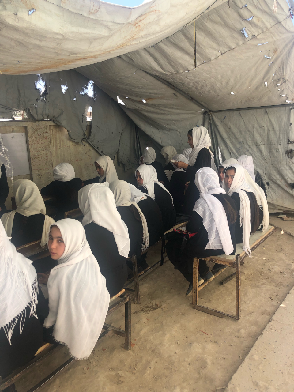Students attending school in tents