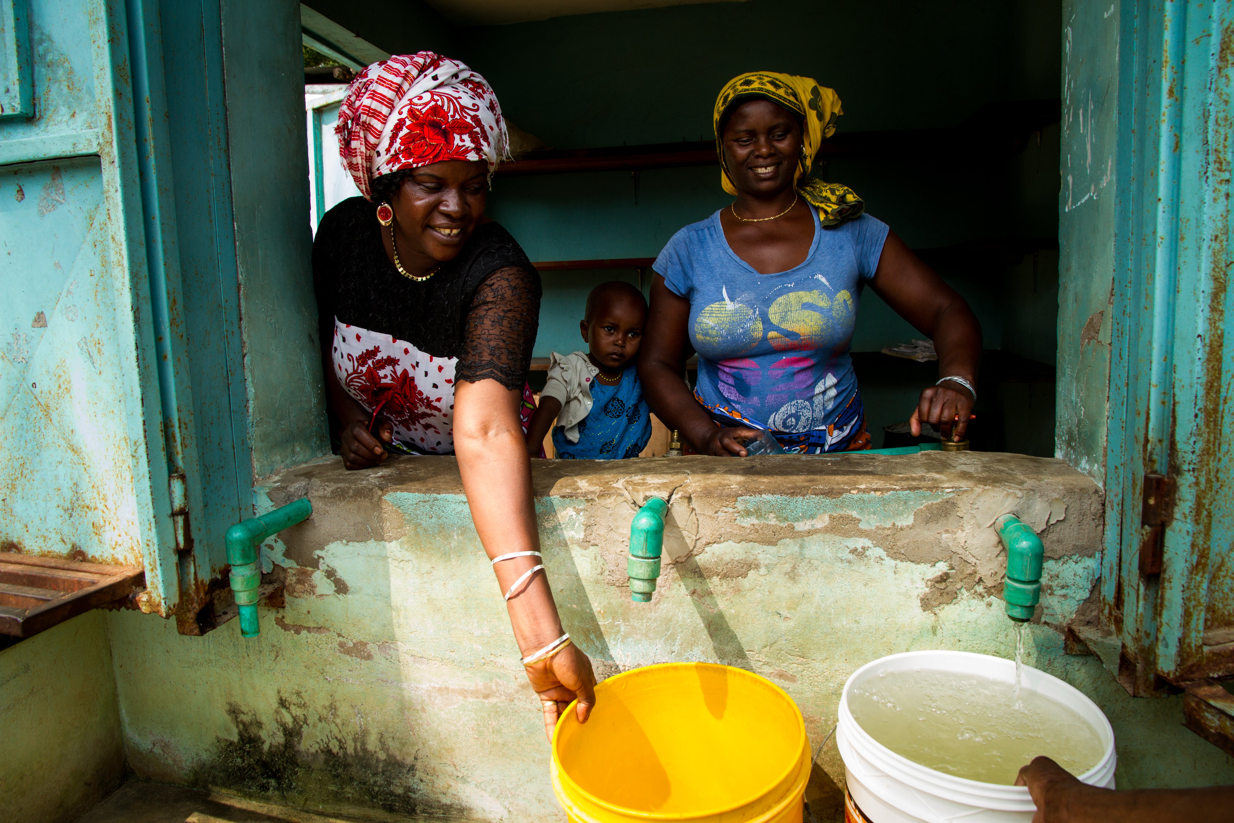 Widows of Majengo in the local water kiosk they run to generate an income. 