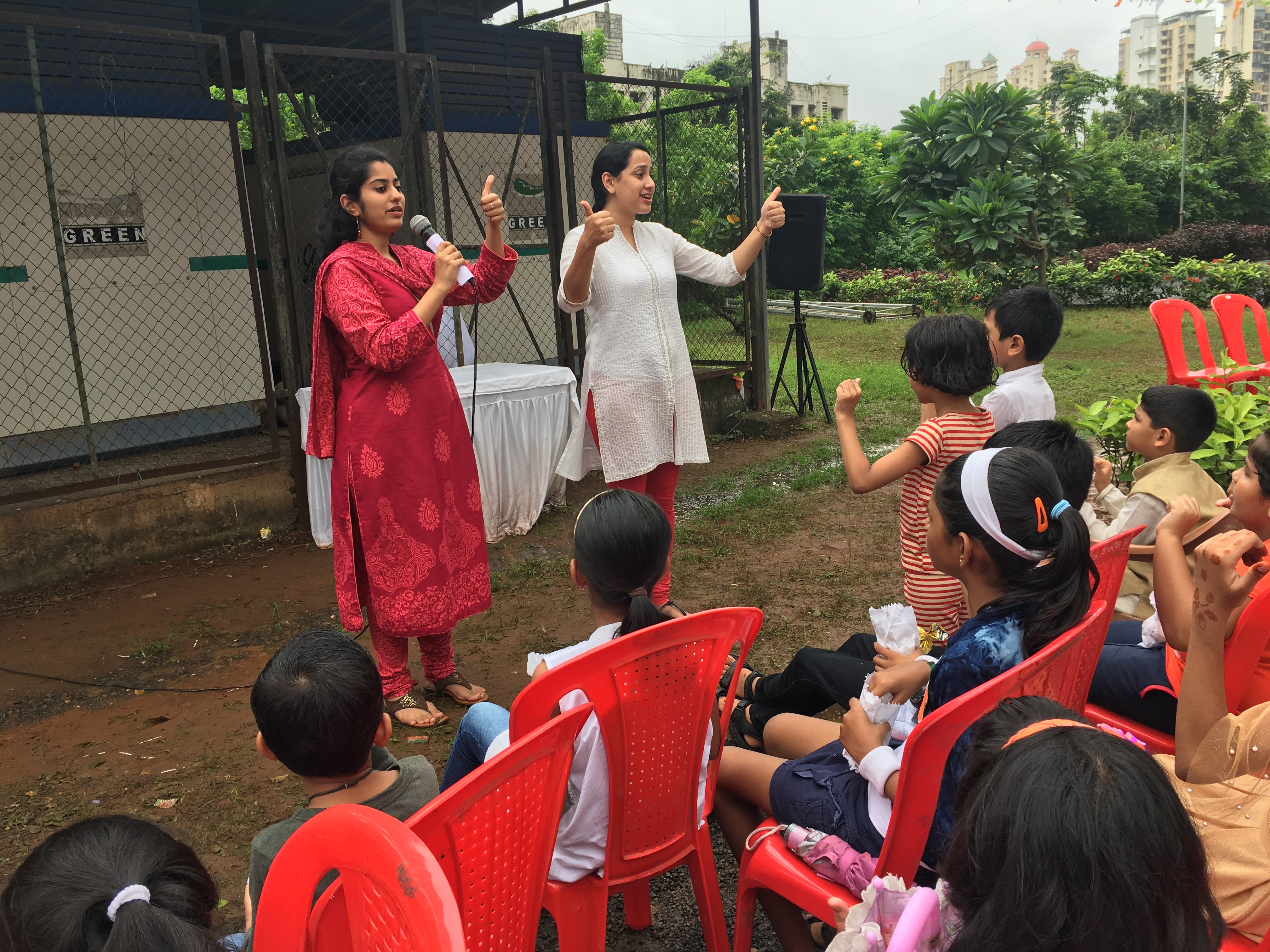 Heeta Lakhani (L) delivers a speech at a Climate Action event in India.