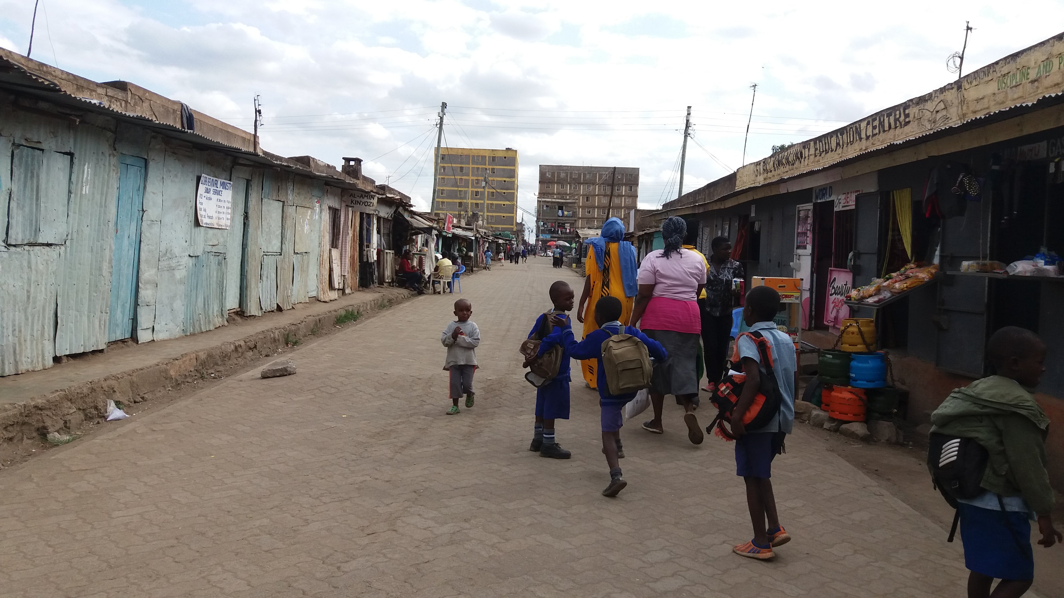 Grey water flowing openly on the street before intervention on the model street