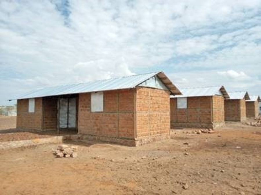 New housing in Kalobeyei that each have a green toilet within