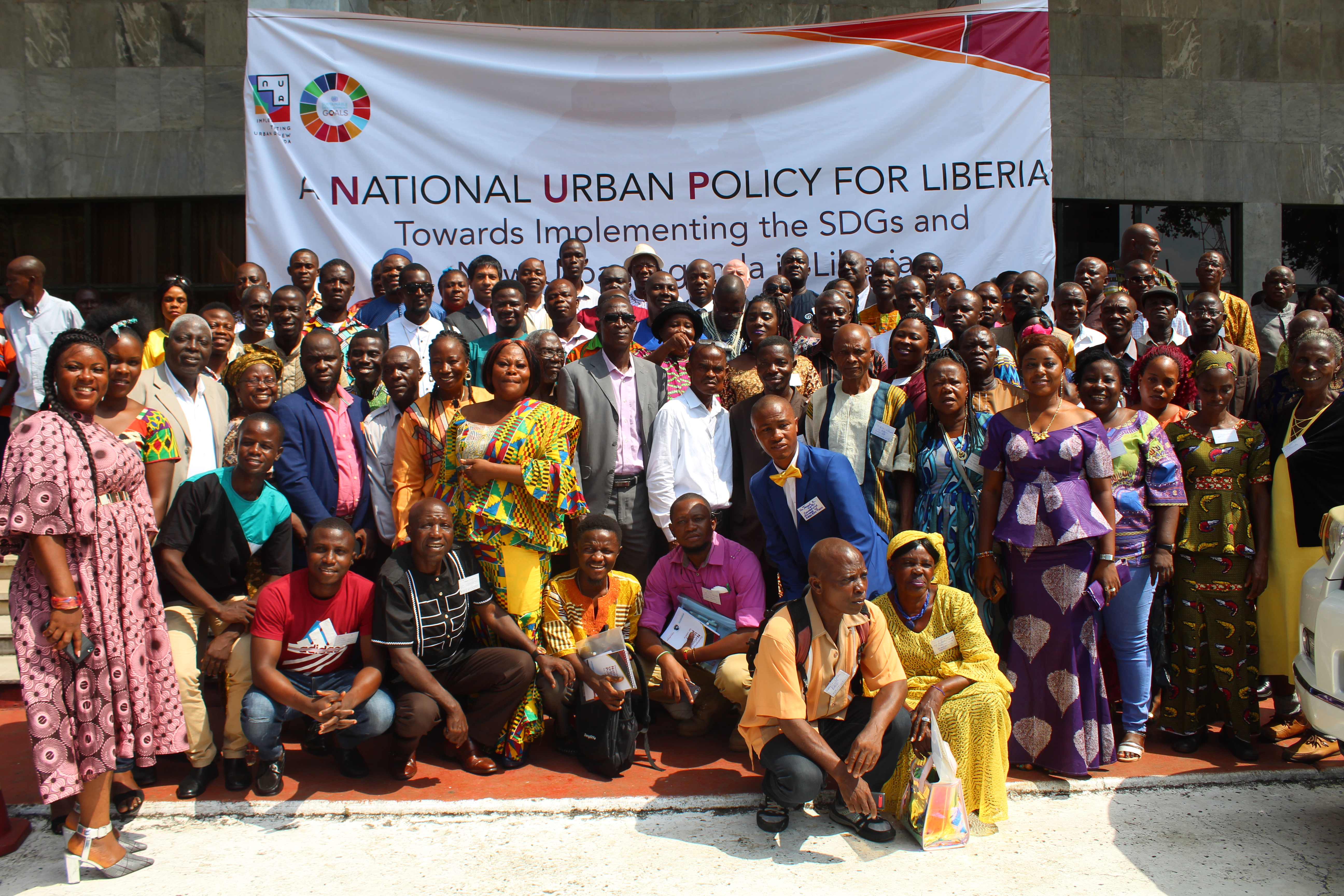 Participants of the National Urban Forum from different parts of Liberia pose for a photo outside Monrovia City Hall, Monrovia.