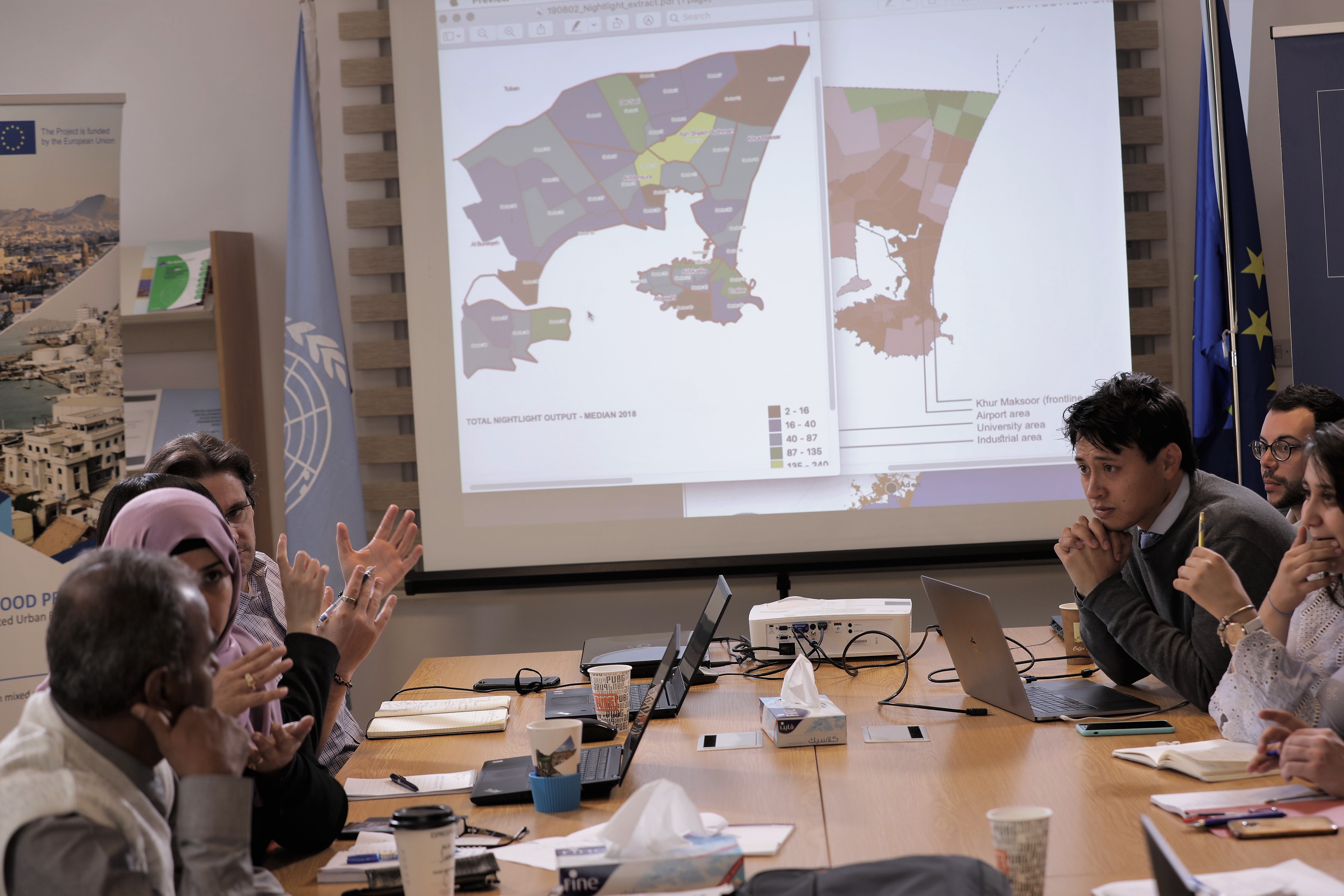 Officials from the Yemeni city of Aden City, UN-Habitat staff and iMMAP during a workshop on the city’s recovery