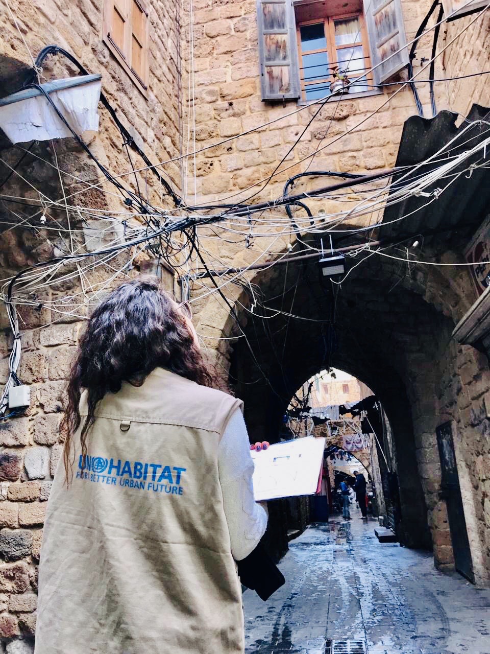 A member of the UN-Habitat Lebanon team carries out a neighbourhood assessment of the built environment in one of the vulnerable neighbourhoods