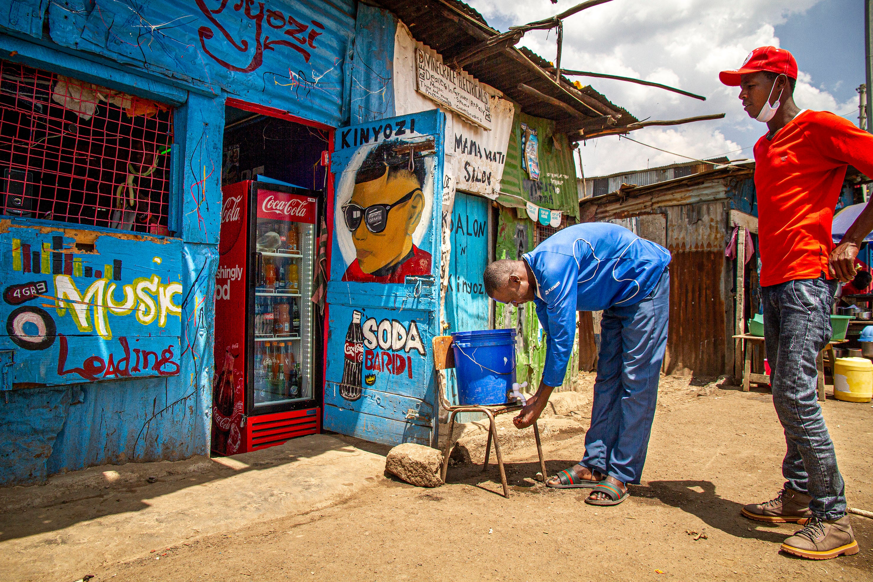 Youth at a handwashing station in Mathare slum, Nairobi, Kenya