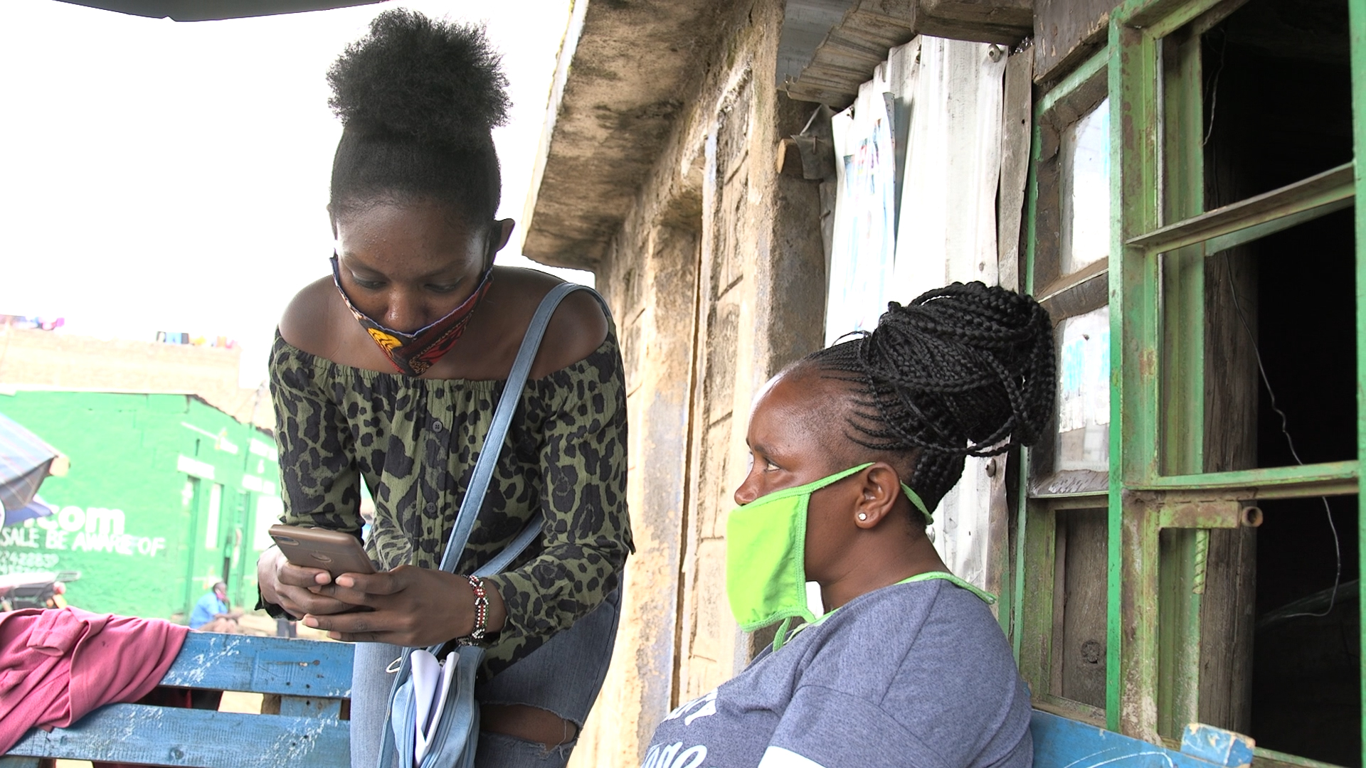 A community volunteer in Kenya’s informal settlement of Mathare inputs information during a UN-Habitat mapping of facilities