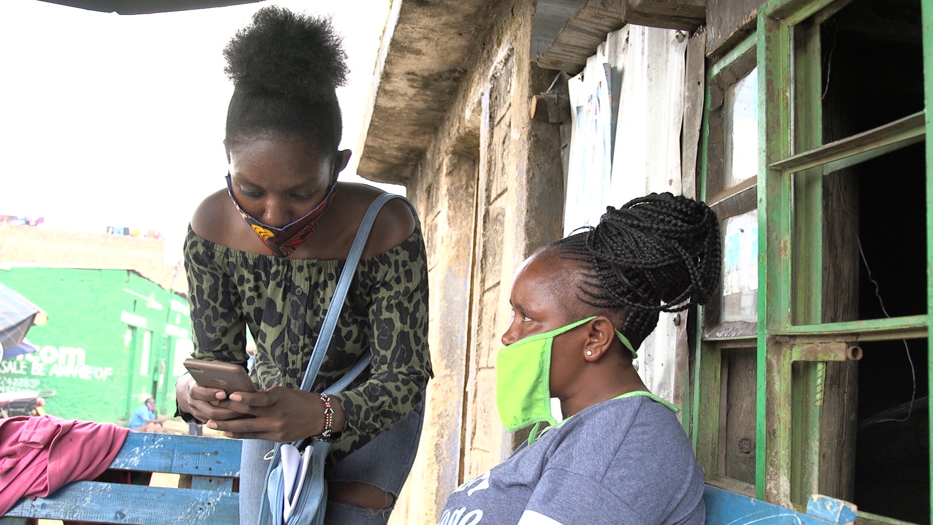 A community volunteer in Kenya’s informal settlement of Mathare inputs information during a UN-Habitat mapping of facilities