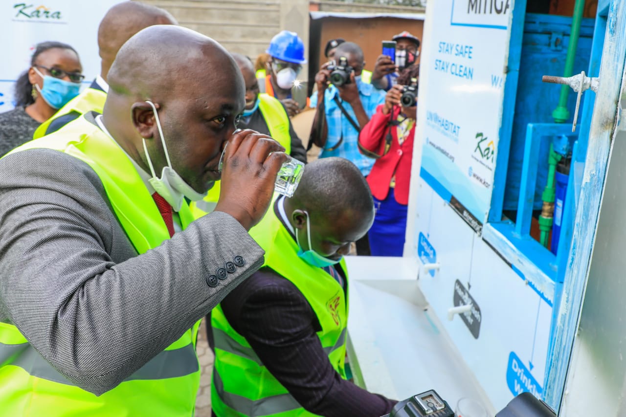 The Deputy Governor of Kenya’s Nakuru Municipality Erick Korir drinks from one of the eight new handwashing facilities funded by UN-Habitat to prevent the spread of COVID-19. The taps are fitted with carbon filters for water purification to make the water clean for drinking