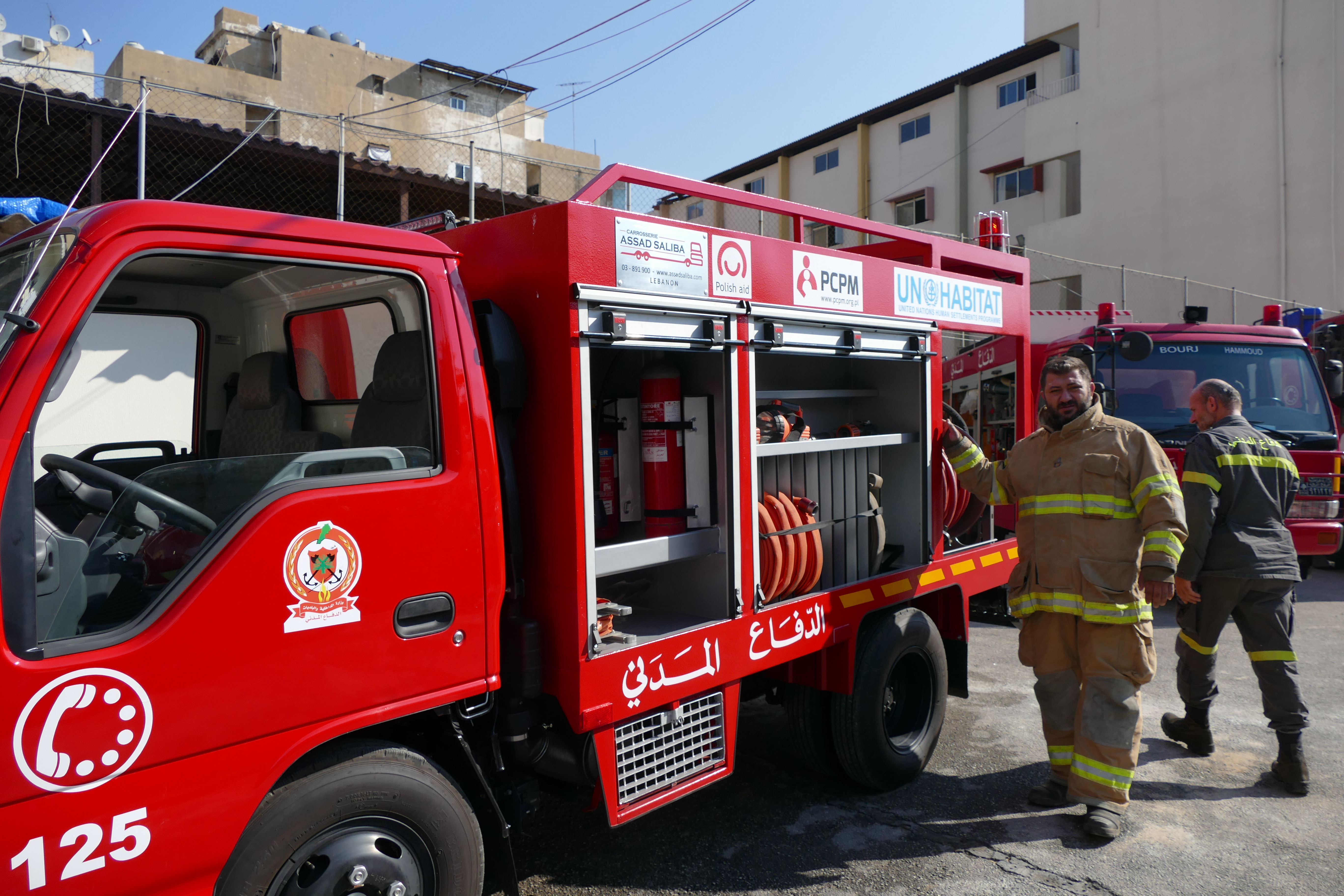 Firefighter from the Lebanese Civil Defense next to the rapid intervention vehicle provided by UN-Habitat and PCPM
