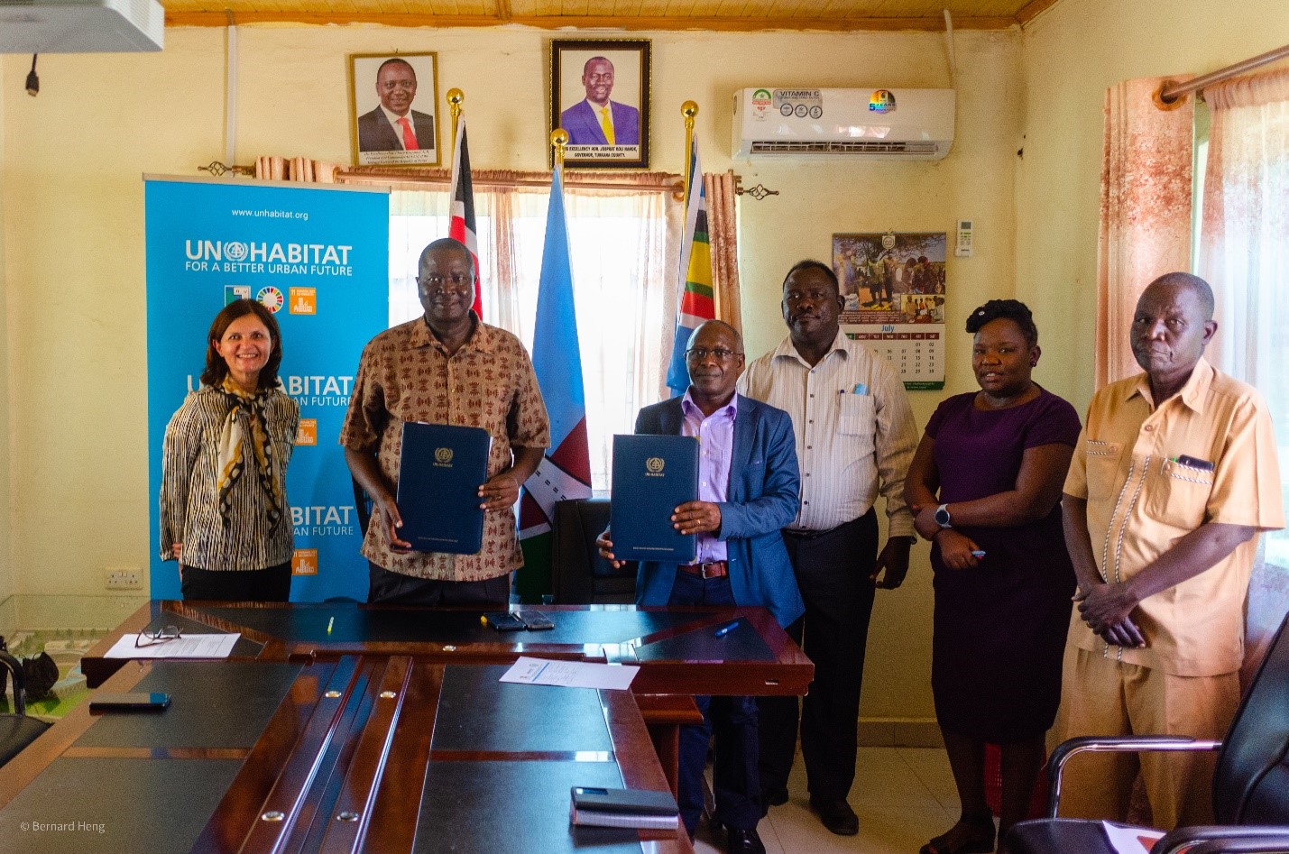Peter Eripete, County Secretary, and Charles Wagura, the Representative for UN-Habitat Regional Office of Africa, showing the signed MoU between UN-Habitat and Turkana County Government