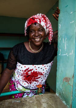 Mrs Mathilda Chonga, 47, Member of the community of Majengo, a slum village on the coast of Kenya; together with other widows the single mother of 6 kids runs a water kiosk in the slum