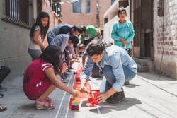 Children painting on street