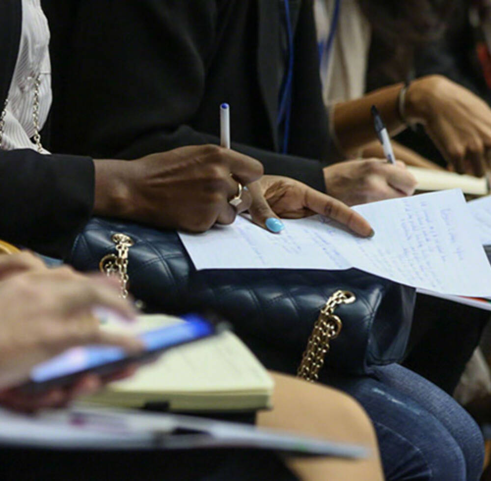 delegates take notes at the UN-Habitat Assembly