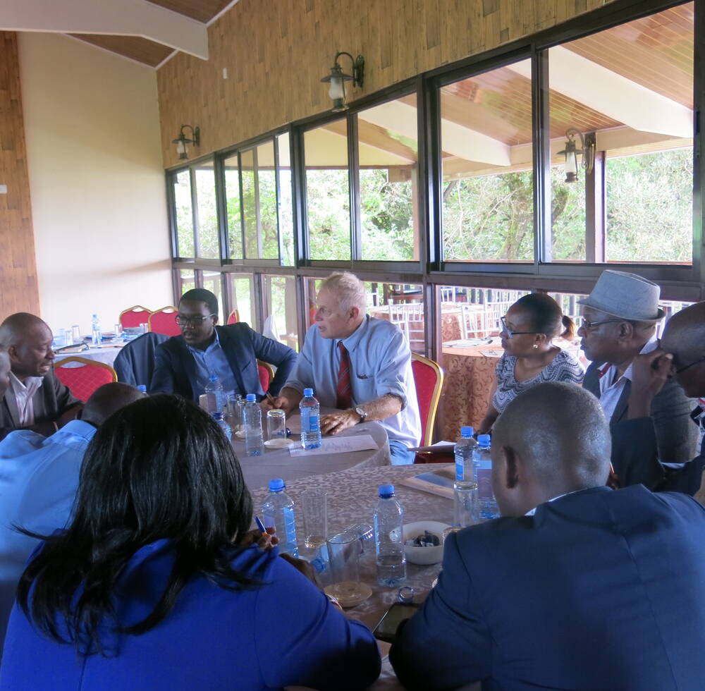 Participants discussing in groups on Urban Development and market assessment in Kajiado County