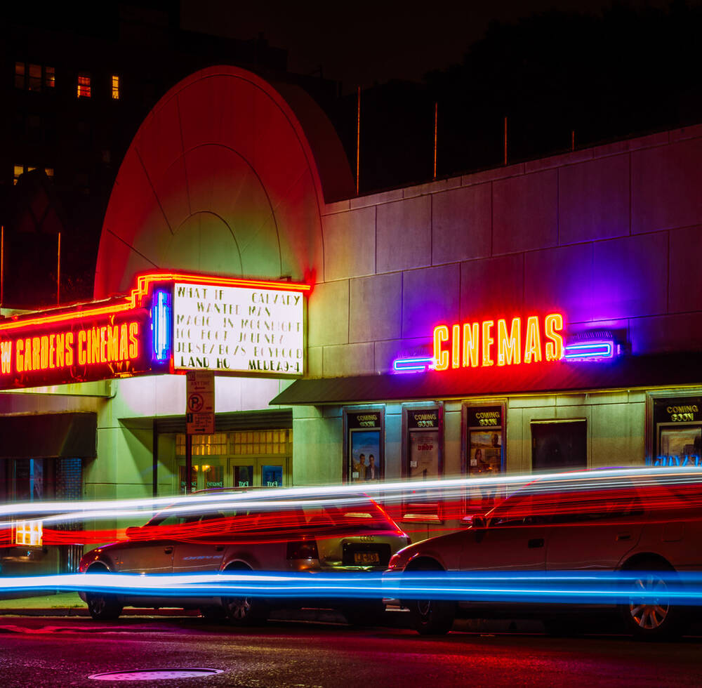A exterior of a cinema at night 