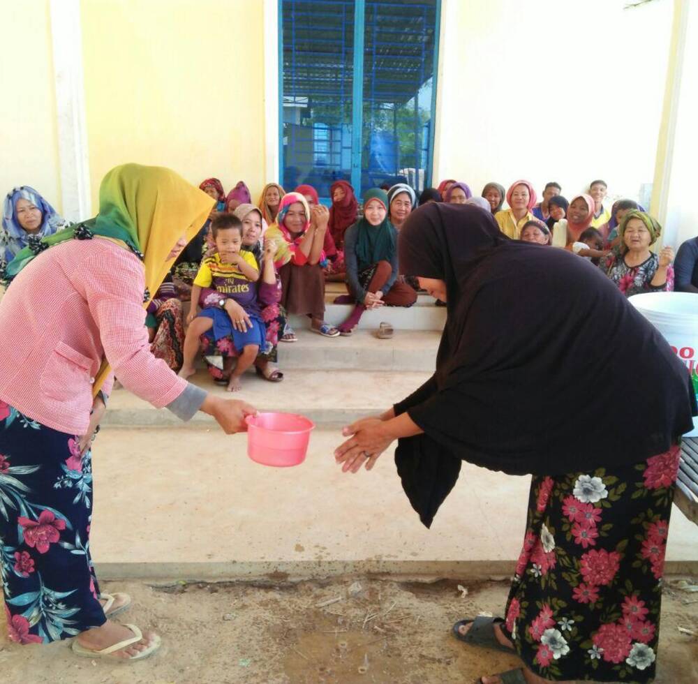 Families in Tboung Khmum district in Cambodia learn proper handwashing techniques
