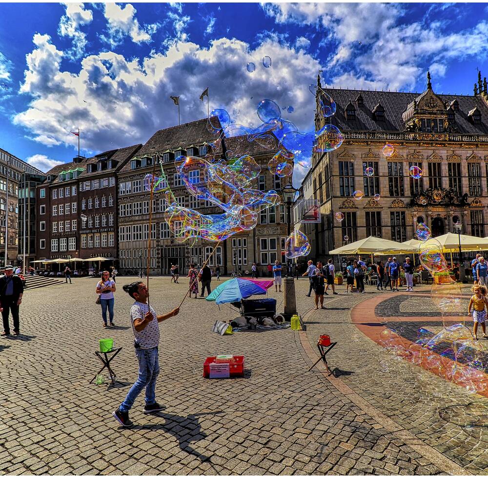Children and adults playing with the city background