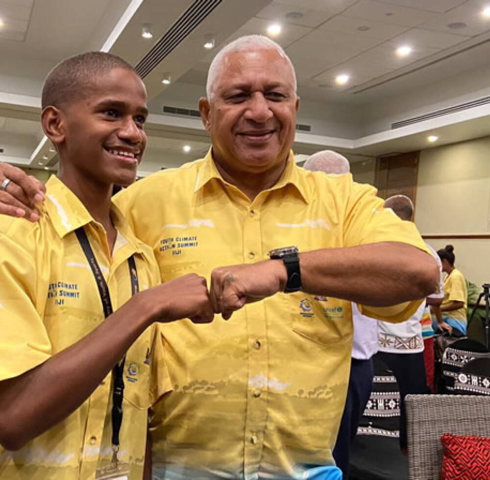 The Prime Minister of Fiji, Josaia Voreqe Bainimarama with youth climate activitist Timothi Nausulasala at the opening of the first Fijian National Youth Climate Action Summit.
