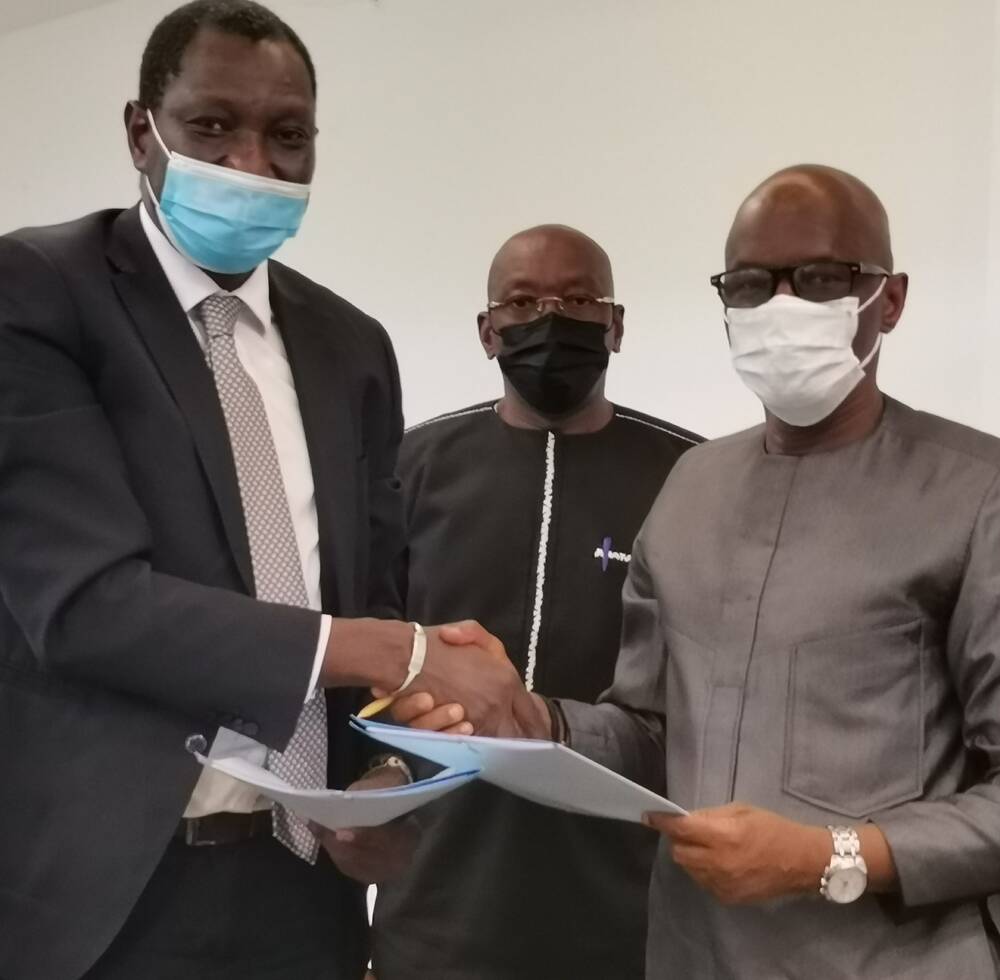 UN-Habitat Acting Regional Representative  for Africa, Oumar Sylla, and Dr. Ibrahima Kourouma, Minister of City and Territorial Planning during the signing of the MoU in Conakry