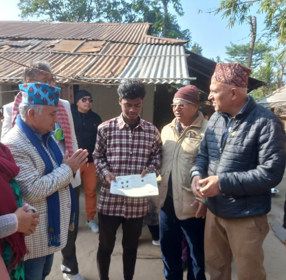 National Commission Chair Mr. Keshav Niraula and Mayor Mr. Rajendra Kumar Pokharel handing over land ownership certificate