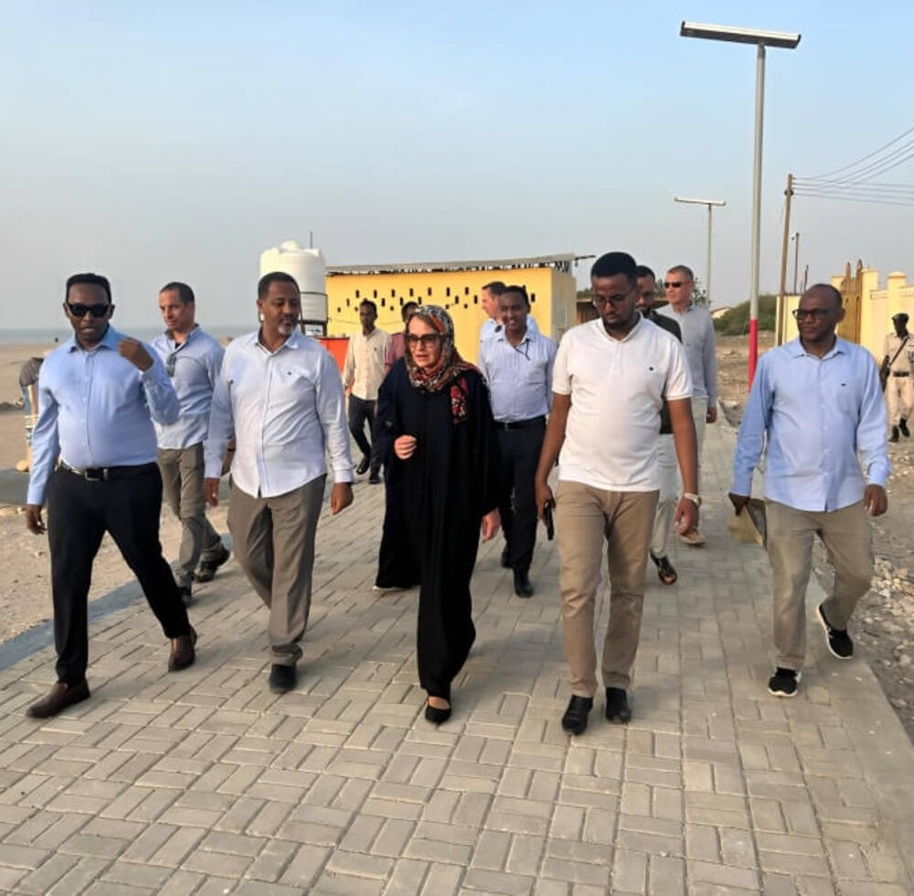 The European Union Ambassador to Somalia, Tiina Intelmann, (middle) is escorted around the Berbera beachfront by a team from UN-Habitat and  a team from the Berbera Municipality led by Abdishakur Mohamoud Hassan, the Mayor of Berbera on 9th August 2023 . © Idiris Mahamoud