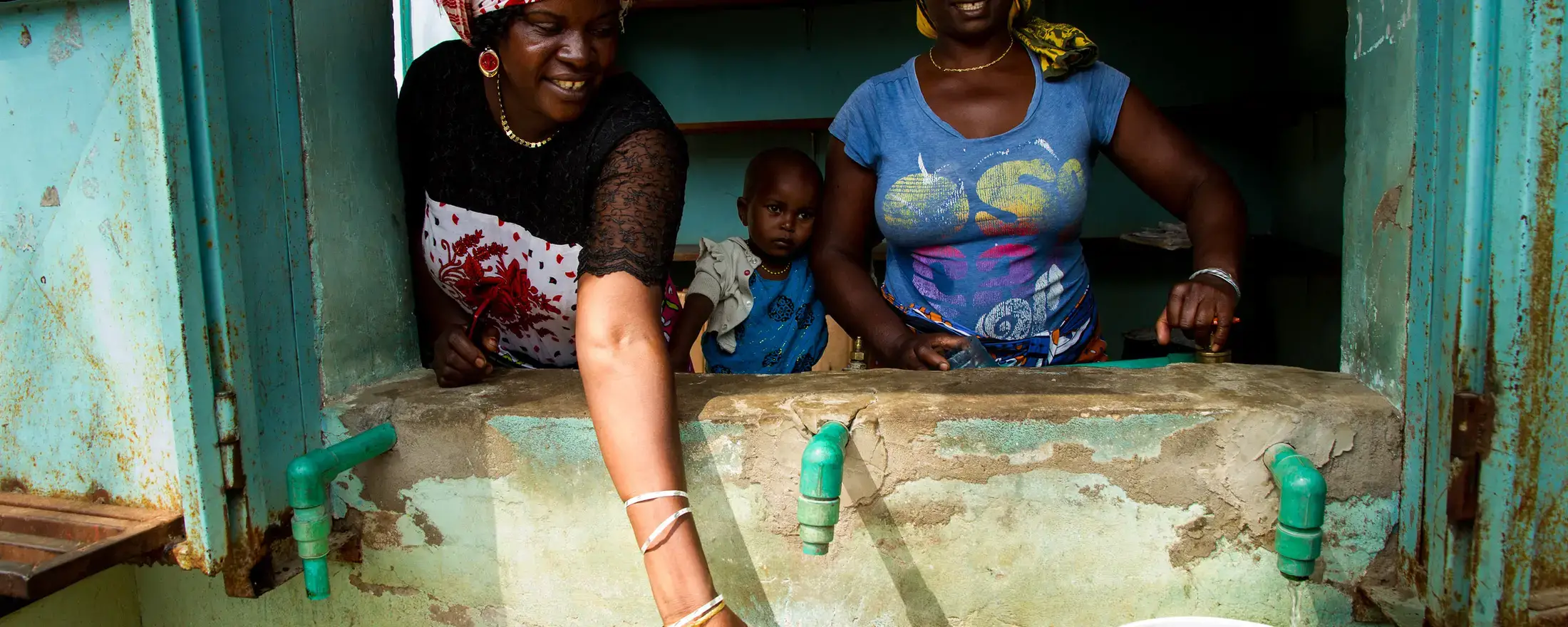 Residents in an informal settlement in Kenya’s coastal Mtwapa area at a water kiosk