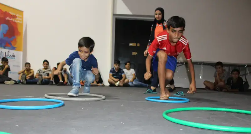 Children participate in an obstacle course event organizaed by the Abjad Centre.