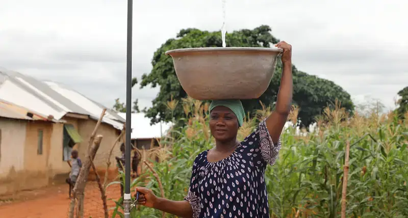 Resident of Ward-K enjoying water supply and handwashing facilities that was donated by the UN Agencies at Ward K Tamale, Ghana 2021
