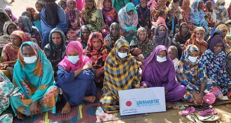 The community of Um Ganah Darfur, Sudan, celebrate the launch of the UN-Habitat project funded by the Government of Japan. The project will benefit some 17,000 returned Internal Displaced Persons (IDPs) and host communities 