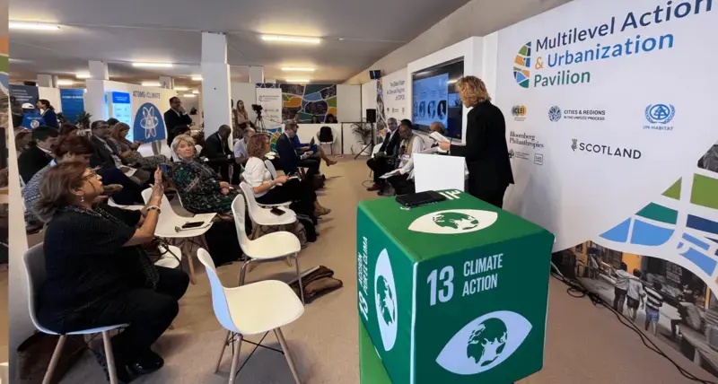 Naomi Hoogervorst moderates an event at the Multi-level Action & Urbanization Pavilion at COP28 [UN-Habitat]