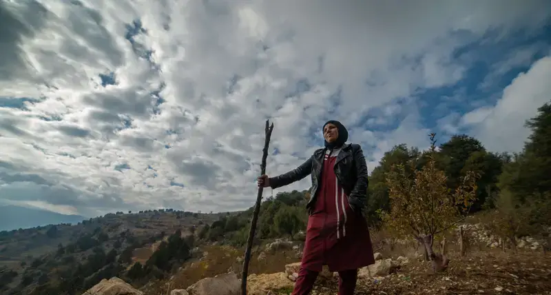 Standing on her land