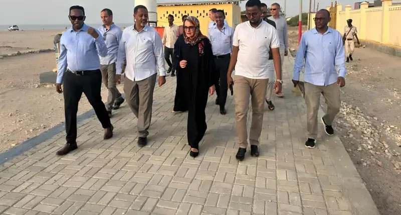 The European Union Ambassador to Somalia, Tiina Intelmann, (middle) is escorted around the Berbera beachfront by a team from UN-Habitat and  a team from the Berbera Municipality led by Abdishakur Mohamoud Hassan, the Mayor of Berbera on 9th August 2023 . © Idiris Mahamoud